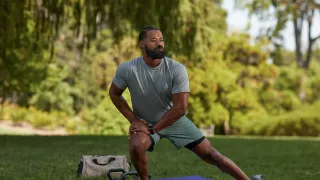 Man stretching in park