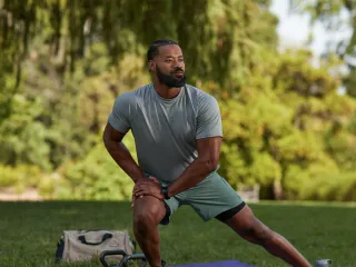 Man stretching in park
