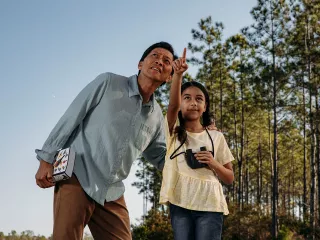 Dad and daughter bird watching
