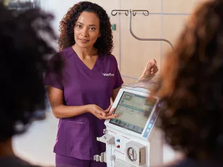 Healthcare professional speaking with colleagues