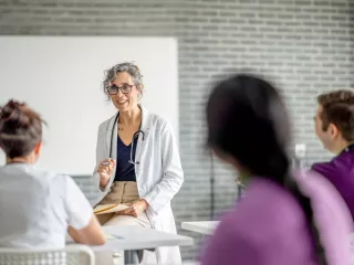 Healthcare professional in a white coat gives a seminar